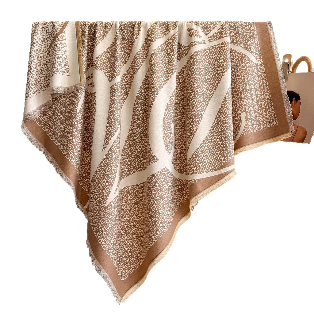 A square scarf with fringed edges, featuring a beige and cream abstract pattern with a repeating geometric motif, shown against a plain white background with a small inset model image on the right.