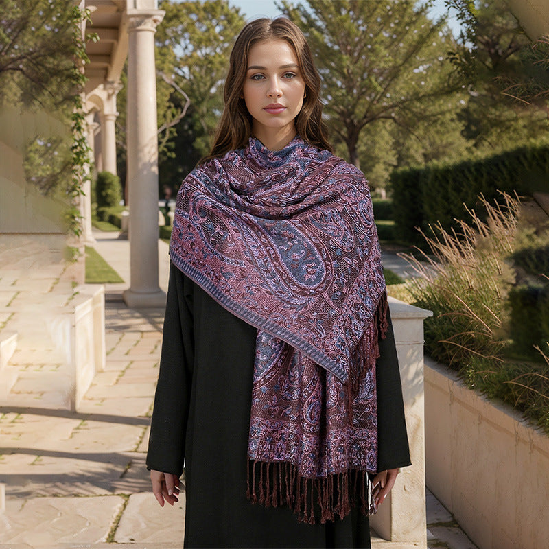 Woman wearing a purple patterned scarf outdoors in a garden setting